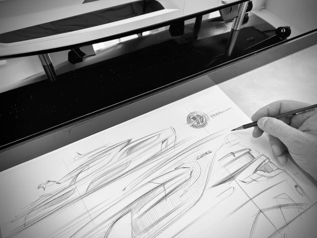 BWD-Holterman-Creative process-a-hand-is-drawing-a-yacht